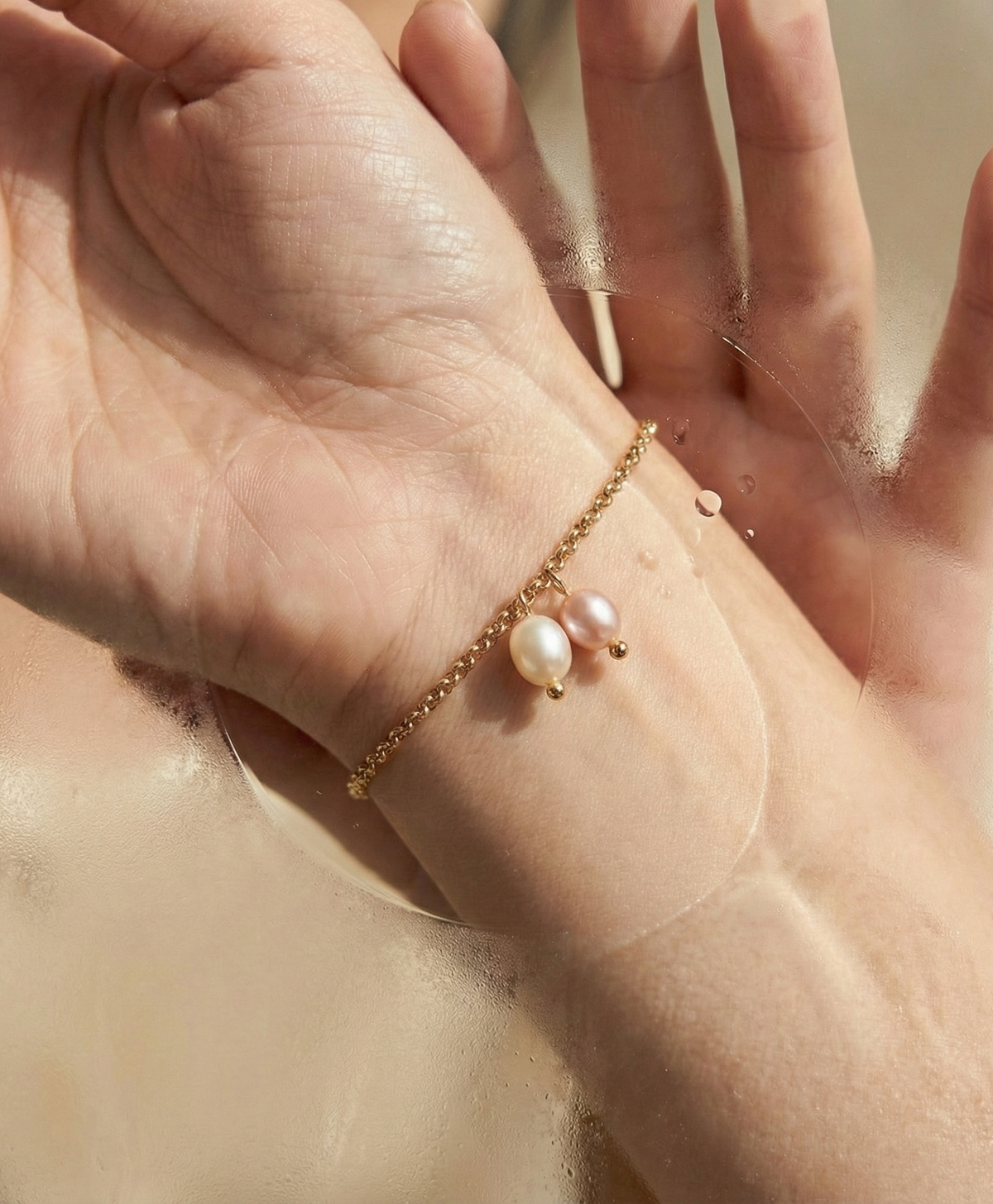 model wearing pearl bracelet in paris cafe near seine