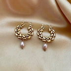 Gold drop earrings featuring a sleek 2.5cm structured gold bar suspended with a lustrous 6mm oval champagne freshwater pearl. Minimalist 18k gold plated jewelry design