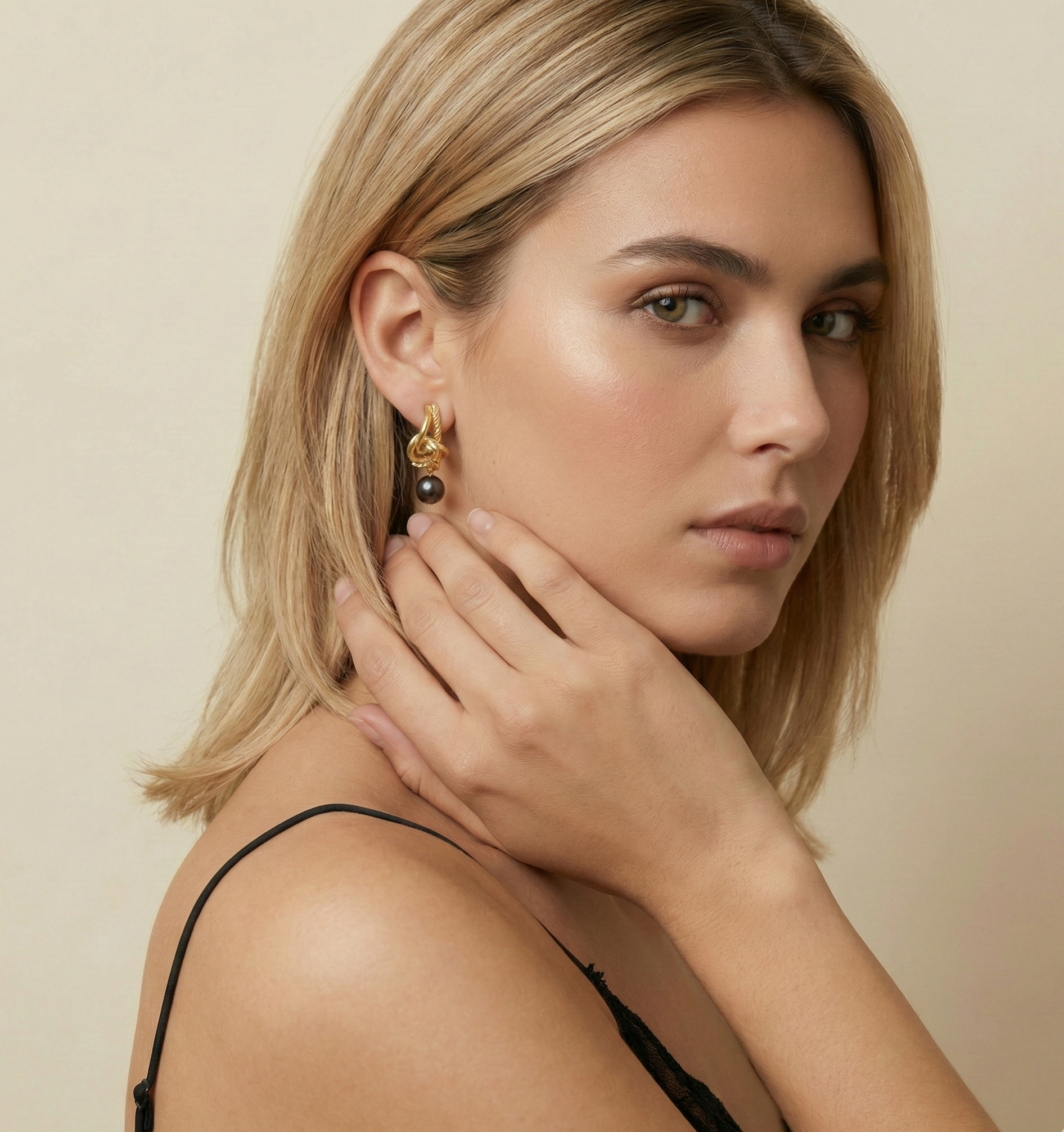 Jewelry inspiration: Stunning gold twist earrings with black pearls. Elegant styling ideas for evening wear featuring a chic updo and black cami