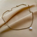 Minimalist gold chain necklace with white baroque pearl pendant