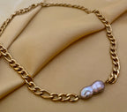 gold Figaro chain necklace featuring a unique grey Keshi baroque pearl with metallic luster