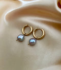 small gold hoop earrings with a metallic grey baroque pearl drop