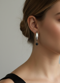 Naomi gold drop earrings featuring a sleek 3cm linear gold bar ending in a round 7mm black freshwater pearl. Minimalist 18k gold plated jewelry